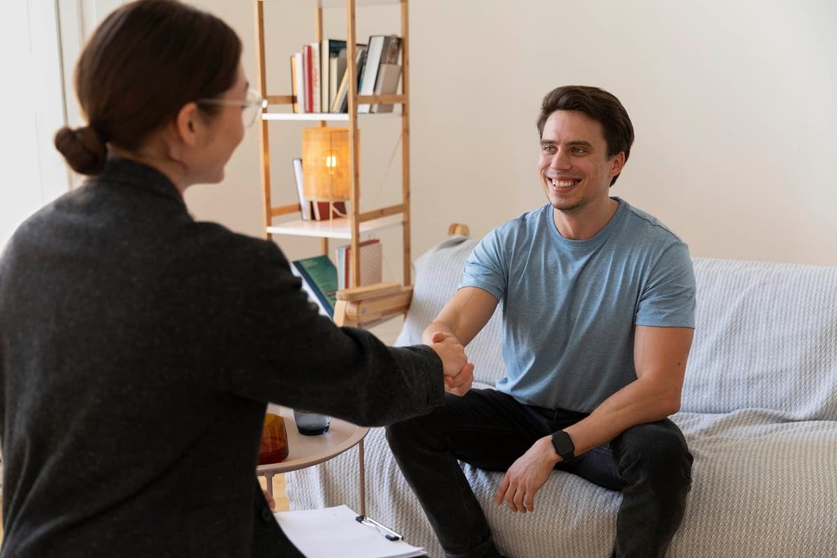 Pediatrician consulting with parent and child about ADHD in professional clinic setting