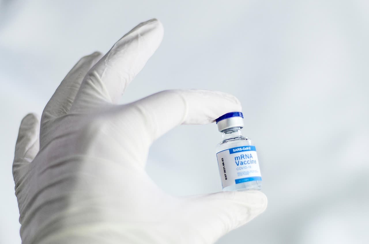 Healthcare provider preparing vaccines for a pediatric patient